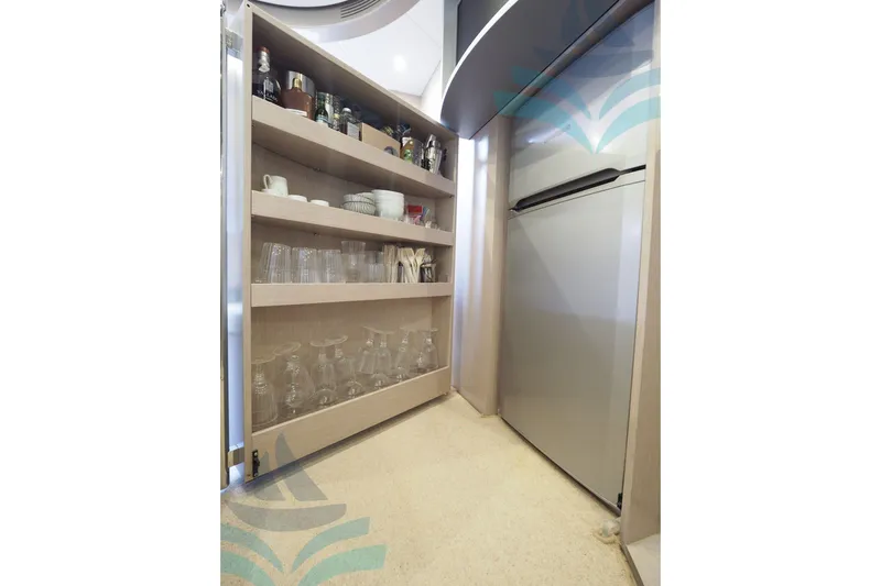  Yacht Photos Pics 2016 Riva 52 Rivale yacht interior with shelves and refrigerator.