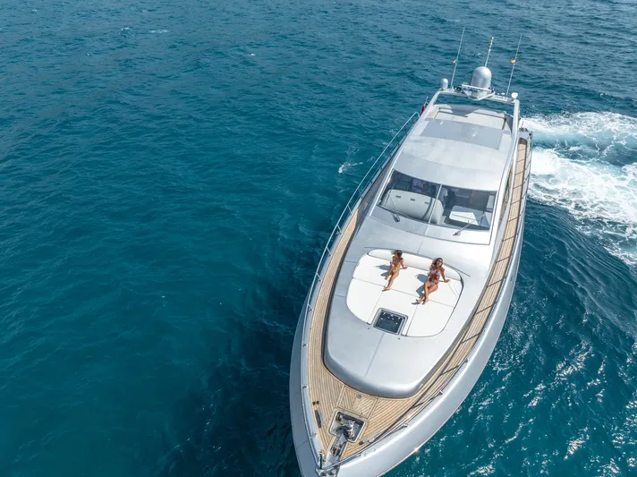 Ganache Yacht Photos Pics Luxury Leopard 24 yacht cruising with two people sunbathing on deck, 2005 model.