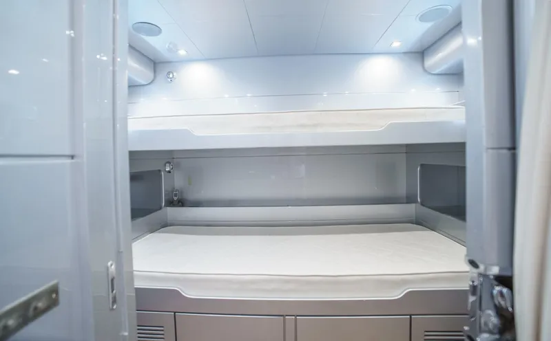Ganache Yacht Photos Pics Interior of a 2005 Leopard 24 yacht featuring modern bunk beds.