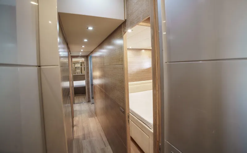 Ganache Yacht Photos Pics Luxurious hallway interior of 2005 Leopard 24 yacht, featuring modern design and ambient lighting.