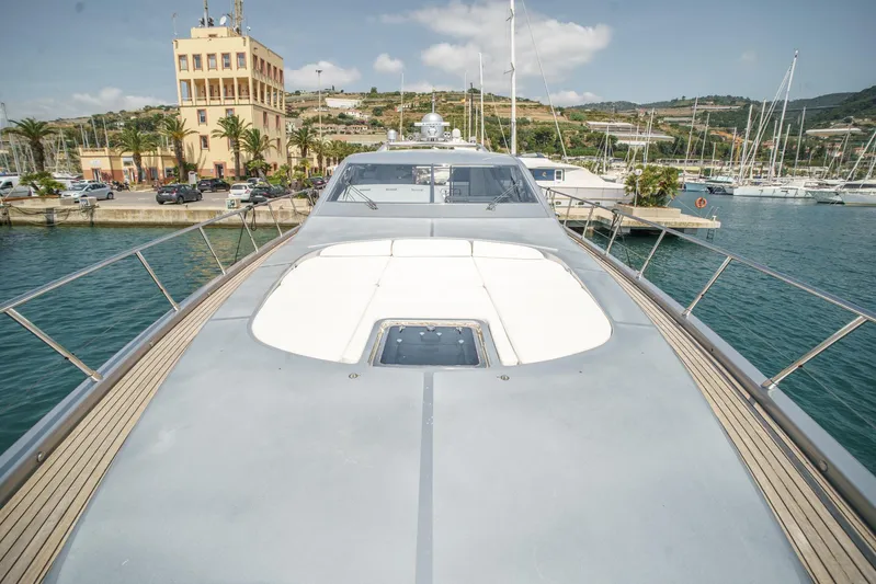 Ganache Yacht Photos Pics Luxury Leopard 24 yacht docked in marina, 2005 model, with scenic coastal backdrop.