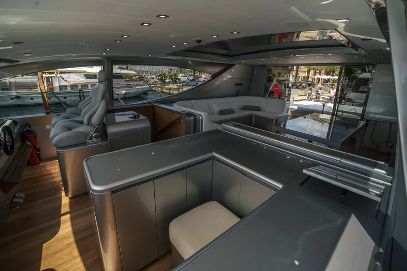 Ganache Yacht Photos Pics Luxurious interior of a 2005 Leopard 24 yacht with modern seating and sleek design.