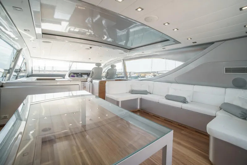 Ganache Yacht Photos Pics Luxurious interior of a 2005 Leopard 24 yacht with modern seating and glass table.