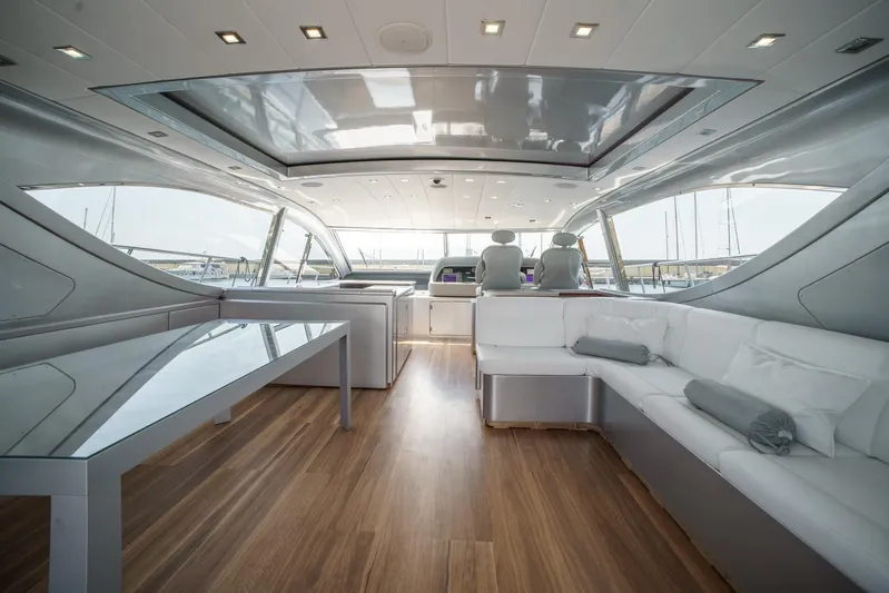 Ganache Yacht Photos Pics Luxurious interior of a 2005 Leopard 24 yacht with modern seating and sleek design.