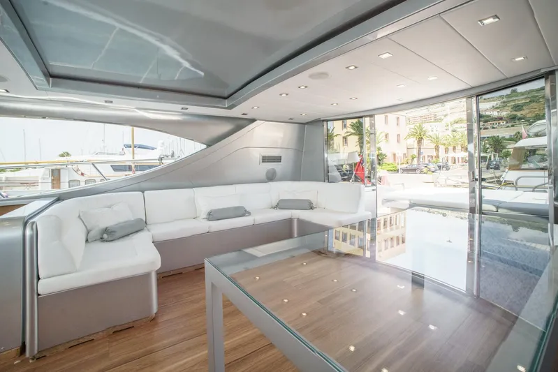 Ganache Yacht Photos Pics Luxurious interior of a 2005 Leopard 24 yacht with modern seating and glass table.