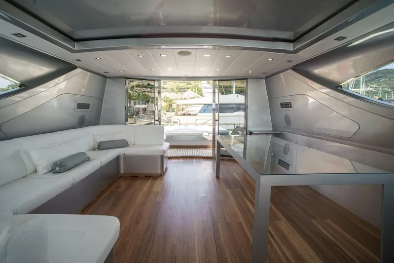 Ganache Yacht Photos Pics Luxurious interior of a 2005 Leopard 24 yacht with modern design and wooden flooring.