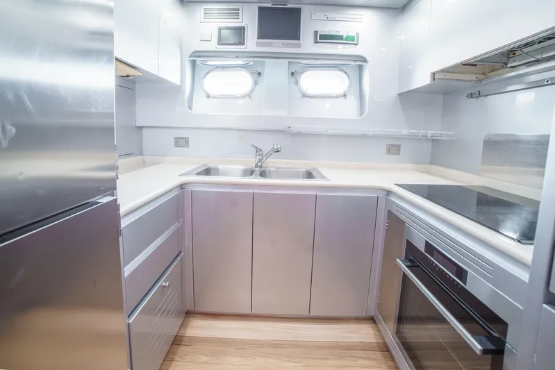 Ganache Yacht Photos Pics Modern yacht kitchen with stainless steel appliances, dual sinks, and sleek cabinetry, Leopard 24, 2005.