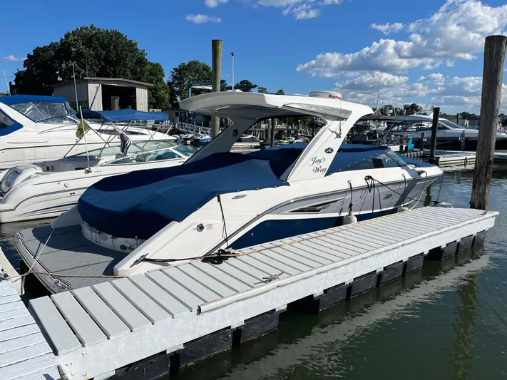  Yacht Photos Pics 2017 Sea Ray SLX 310 boat docked at marina under blue sky.