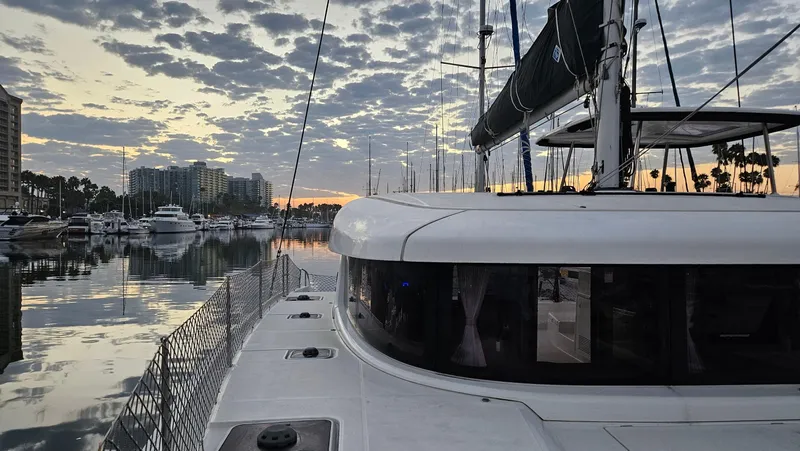Ariella Yacht Photos Pics Lagoon 42 catamaran docked at marina during sunset, 2021 model.