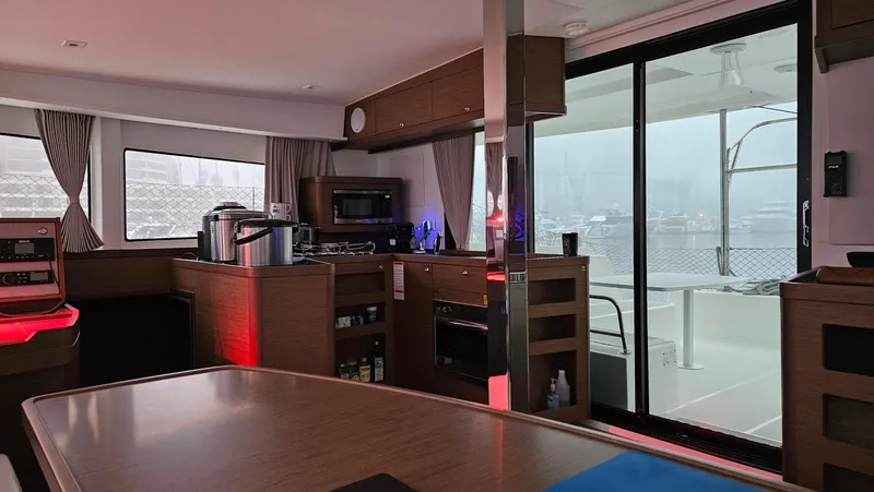 Ariella Yacht Photos Pics Interior of 2021 Lagoon 42 catamaran with modern kitchen and large windows.