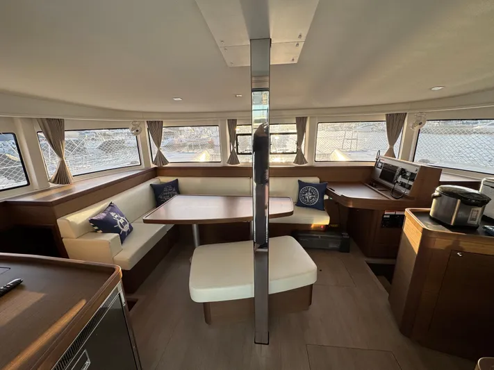 Ariella Yacht Photos Pics Interior of 2021 Lagoon 42 catamaran with modern seating and dining area.