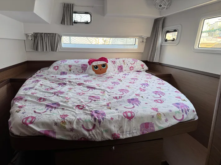 Ariella Yacht Photos Pics Cozy bedroom in 2021 Lagoon 42 yacht with playful bedding and plush toy.