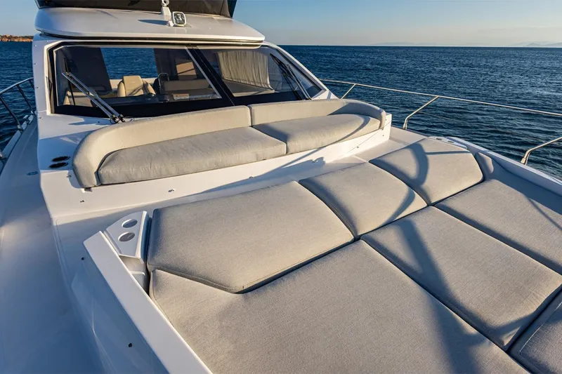 Mask Yacht Photos Pics 2023 Azimut 53 yacht with luxurious sunbathing deck on open sea.