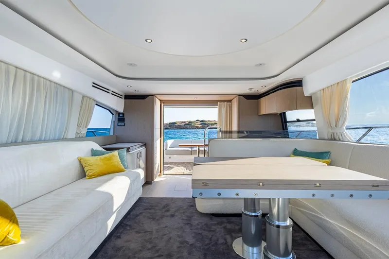 Mask Yacht Photos Pics Luxurious interior of 2023 Azimut 53 yacht with elegant seating and ocean view.