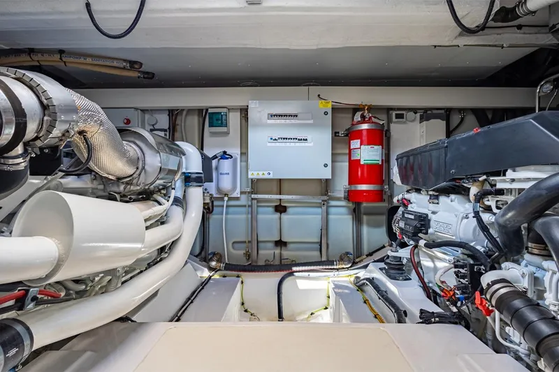 Mask Yacht Photos Pics Engine room of 2023 Azimut 53 yacht, featuring modern equipment and fire safety system.