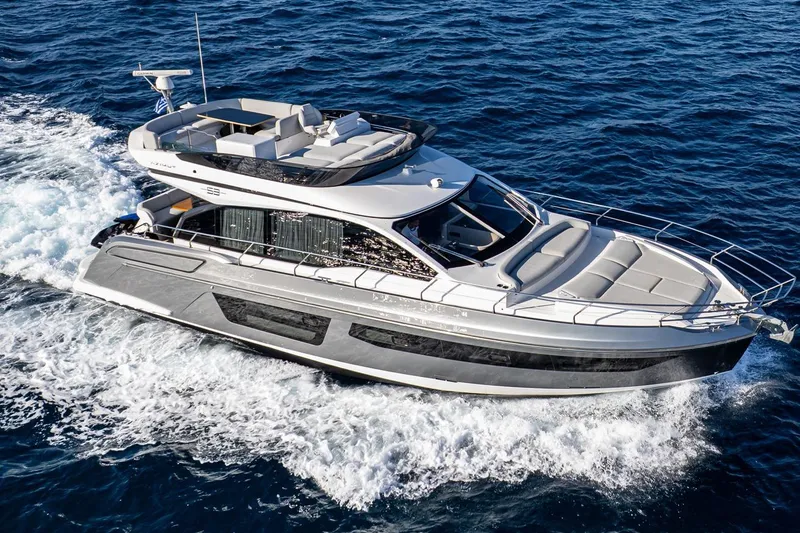 Mask Yacht Photos Pics 2023 Azimut 53 yacht cruising on open sea, showcasing sleek design and luxury features.