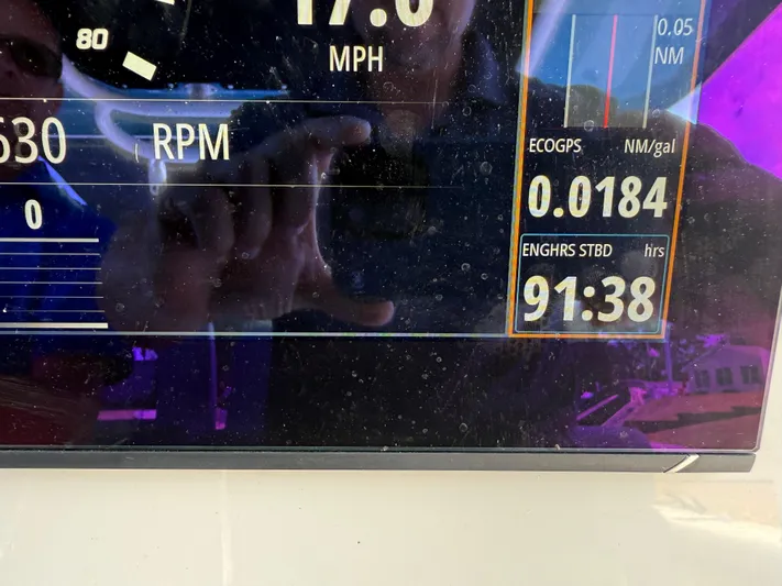  Yacht Photos Pics Display screen of 2024 Boston Whaler 330 Outrage showing speed, RPM, and engine hours.