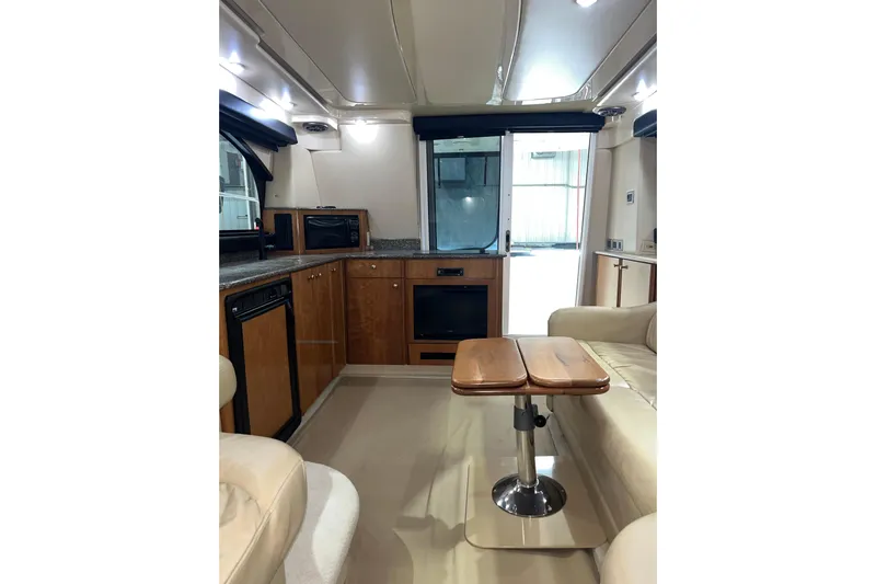  Yacht Photos Pics Interior of 2004 Meridian 341 Sedan yacht with modern kitchen and seating area.