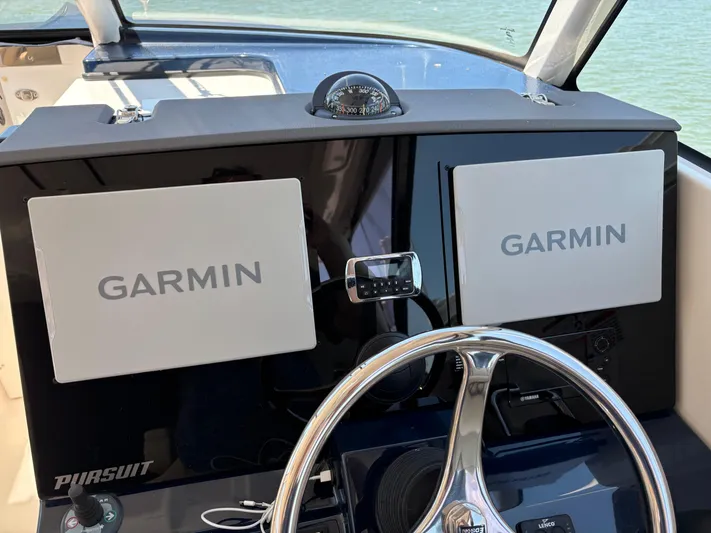  Yacht Photos Pics 2017 Pursuit DC 325 Dual Console helm with Garmin displays and steering wheel.