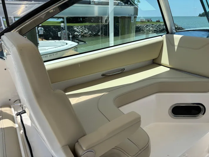  Yacht Photos Pics 2017 Pursuit DC 325 Dual Console interior with beige seating and lake view.