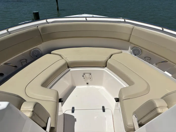  Yacht Photos Pics 2017 Pursuit DC 325 Dual Console boat with beige seating, on calm water.