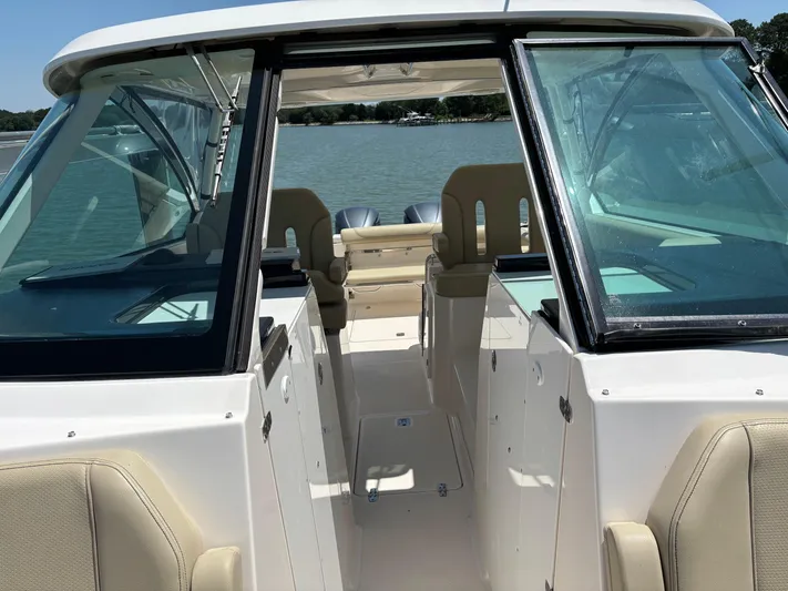  Yacht Photos Pics 2017 Pursuit DC 325 Dual Console boat interior with open cockpit and seating.