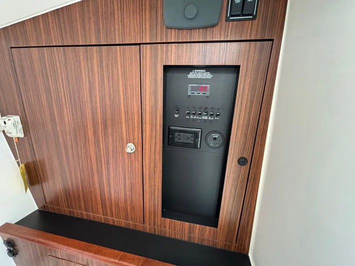  Yacht Photos Pics Control panel on 2017 Pursuit DC 325 Dual Console boat with wood finish.