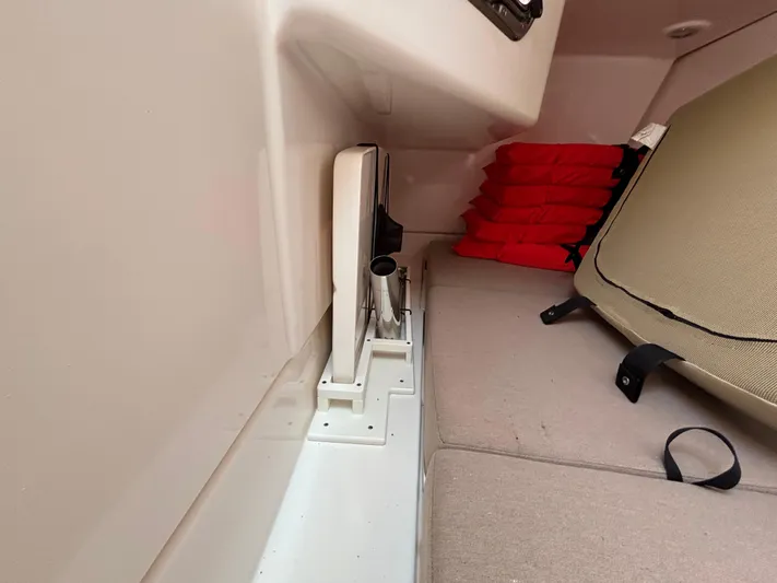  Yacht Photos Pics Interior of 2017 Pursuit DC 325 Dual Console with red life jackets and beige seating.