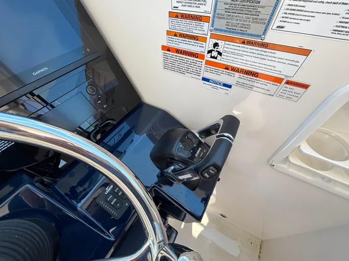  Yacht Photos Pics 2017 Pursuit DC 325 Dual Console helm with controls and warning labels.