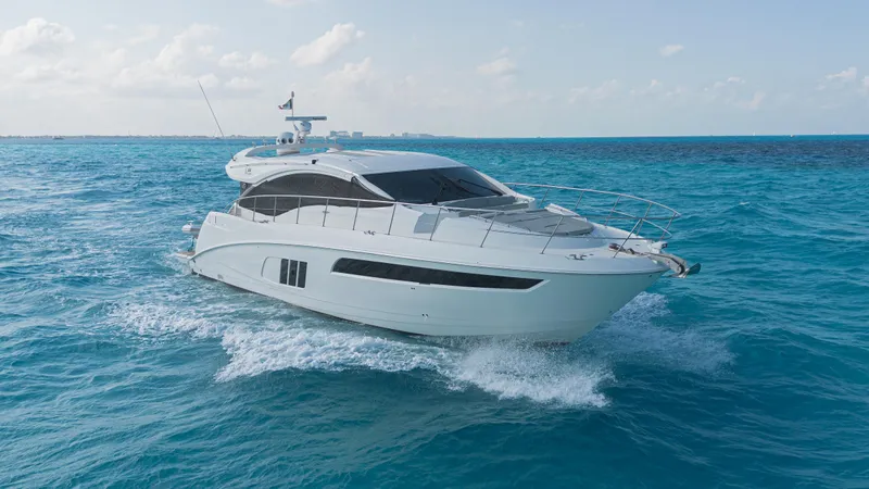 Wallys World Yacht Photos Pics 2017 Sea Ray L590 yacht cruising on clear blue ocean waters.