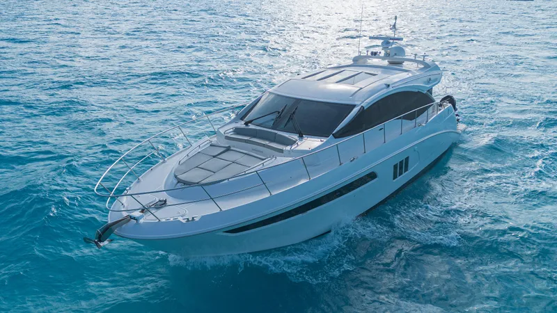 Wallys World Yacht Photos Pics 2017 Sea Ray L590 yacht cruising on clear blue ocean waters.