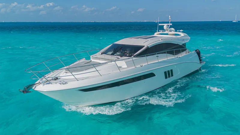Wallys World Yacht Photos Pics 2017 Sea Ray L590 yacht cruising on clear turquoise waters.