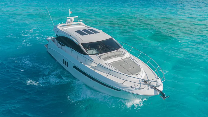Wallys World Yacht Photos Pics 2017 Sea Ray L590 yacht cruising on clear turquoise waters.