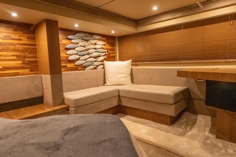 Wallys World Yacht Photos Pics Luxurious interior of 2017 Sea Ray L590 yacht with cozy seating and elegant decor.