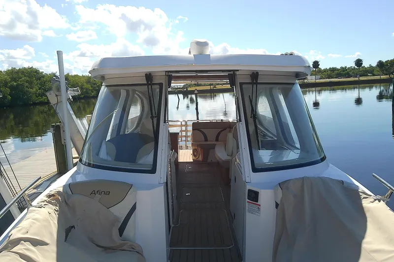  Yacht Photos Pics 2019 Floe Craft 3950C Aquafina boat docked on a serene lake.