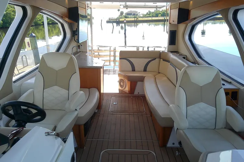  Yacht Photos Pics Luxurious 2019 Floe Craft 3950C Aquafina boat interior with elegant seating and scenic water view.