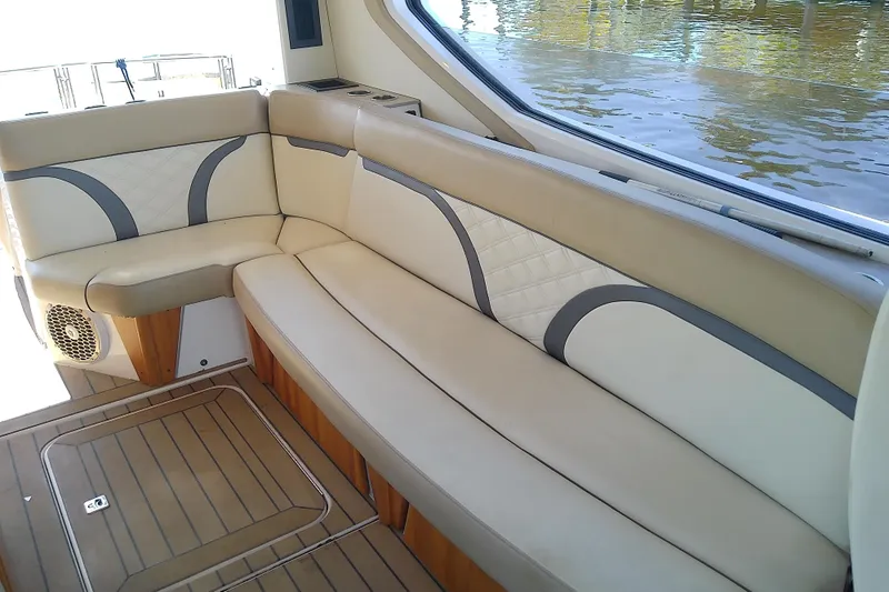  Yacht Photos Pics 2019 Floe Craft 3950C Aquafina boat interior with beige seating and wood flooring.