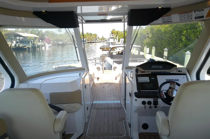  Yacht Photos Pics Interior view of 2019 Floe Craft 3950C Aquafina boat, featuring helm and waterway.