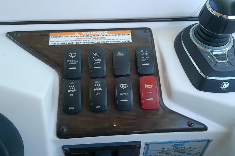  Yacht Photos Pics Control panel of 2019 Floe Craft 3950C Aquafina with various switches and warning label.
