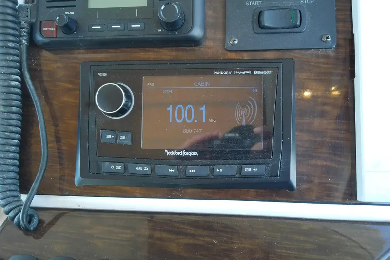  Yacht Photos Pics 2019 Floe Craft 3950C Aquafina dashboard with Rockford Fosgate radio display, tuned to 100.1 FM.
