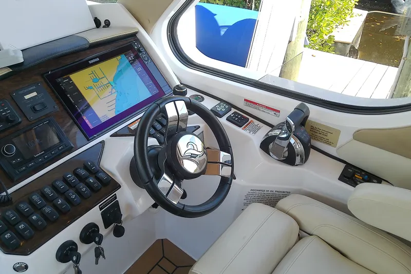  Yacht Photos Pics Cockpit of 2019 Floe Craft 3950C Aquafina with navigation system and steering wheel.