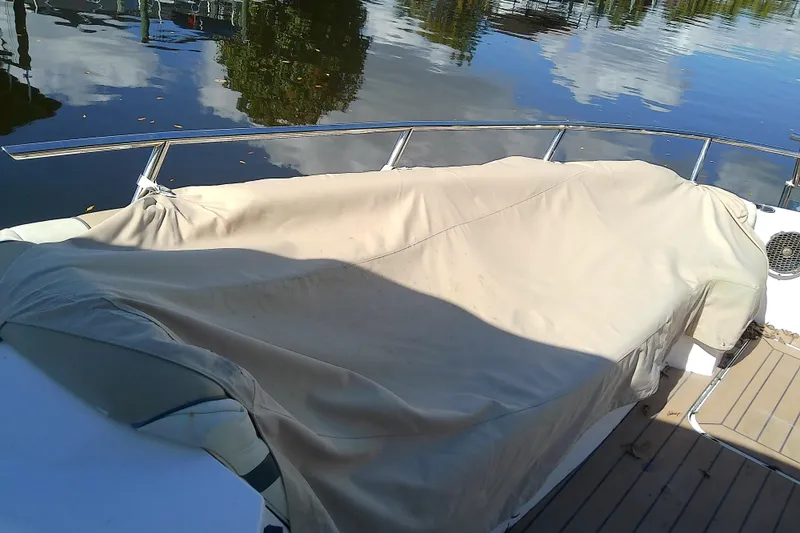  Yacht Photos Pics 2019 Floe Craft 3950C Aquafina boat with covered seating area on calm water.