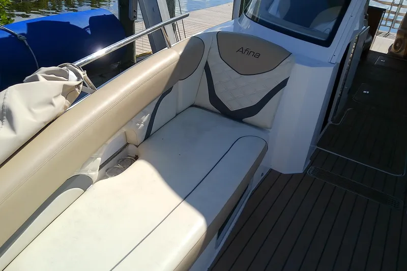  Yacht Photos Pics 2019 Floe Craft 3950C Aquafina boat interior with beige seating and wooden deck.