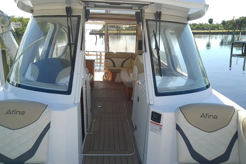  Yacht Photos Pics 2019 Floe Craft 3950C Aquafina boat interior with seating and lake view.