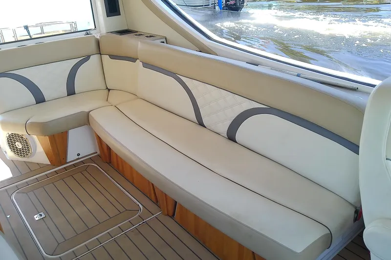  Yacht Photos Pics Luxurious seating in 2019 Floe Craft 3950C Aquafina boat, featuring elegant beige and white upholstery.