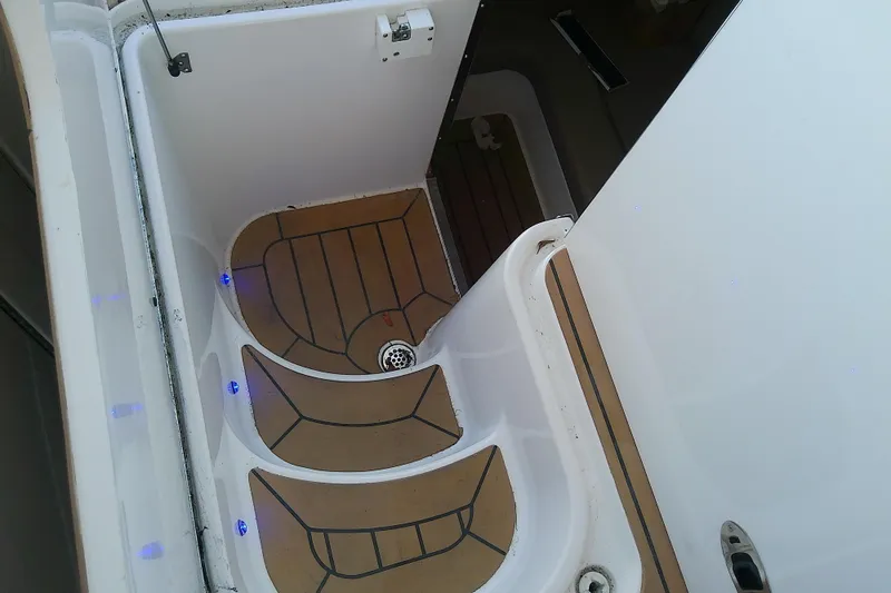 Yacht Photos Pics 2019 Floe Craft 3950C Aquafina boat interior with wooden steps and blue LED lights.