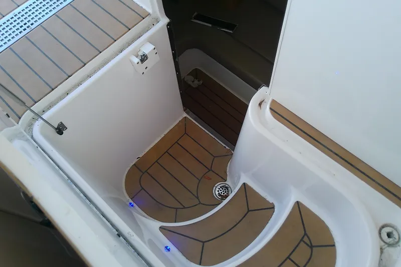  Yacht Photos Pics 2019 Floe Craft 3950C Aquafina boat interior with teak flooring and drainage system.