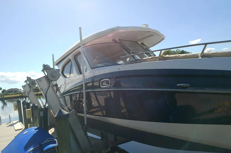  Yacht Photos Pics 2019 Floe Craft 3950C Aquafina boat docked under clear blue sky.