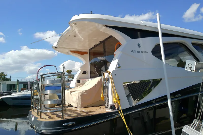  Yacht Photos Pics 2019 Floe Craft 3950C Aquafina yacht docked under a clear blue sky.