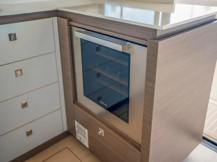 Breathe Yacht Photos Pics Modern kitchen appliance on Leopard 53 Powercat 2020 yacht, featuring sleek cabinetry and built-in oven.